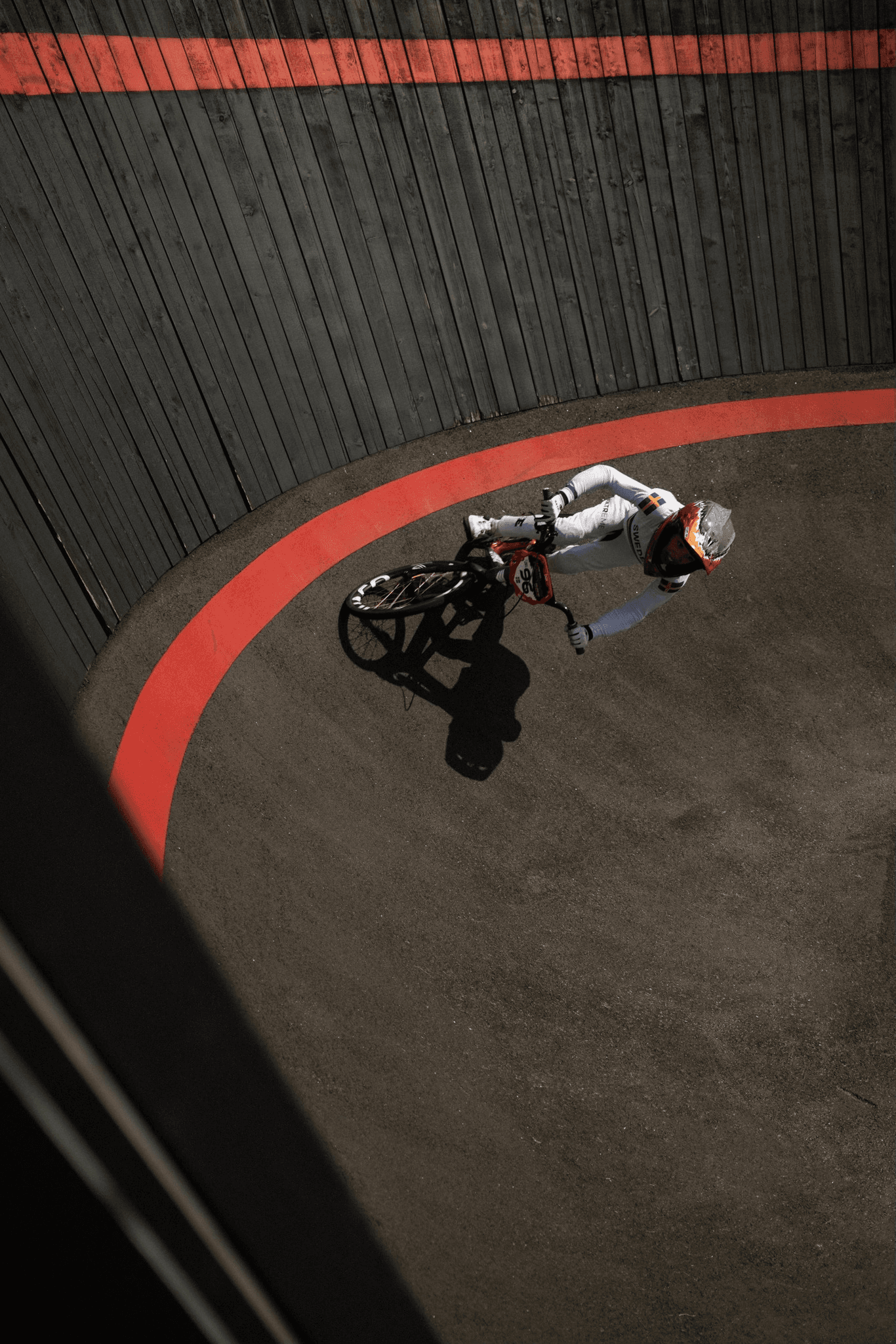 Aerial view of BMX rider on banked turn